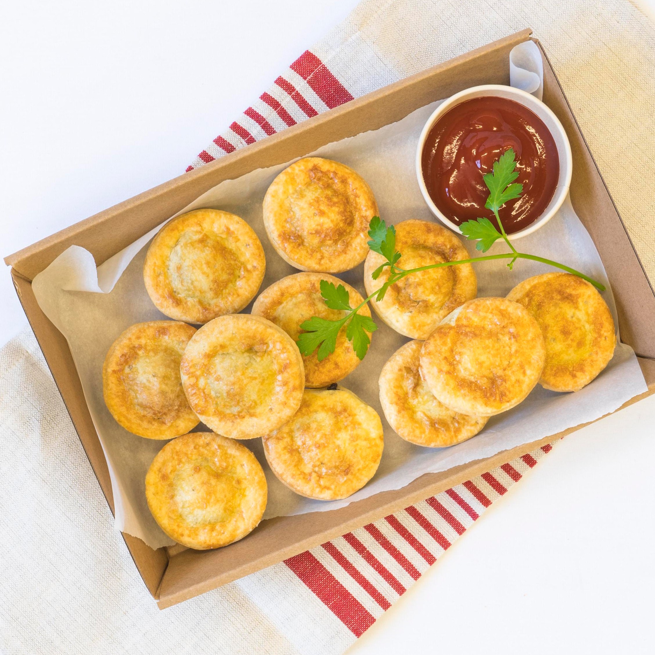 Classic party pies, tomato sauce