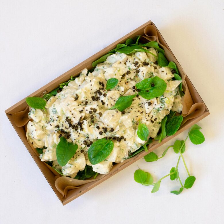 Farm fresh potato salad, baby spinach, garden herbs, fried capers