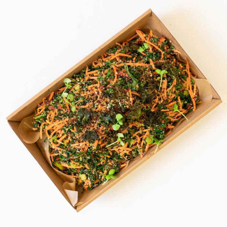 Superfoods salad of kale & quinoa, fresh vegetables, tahini dressing