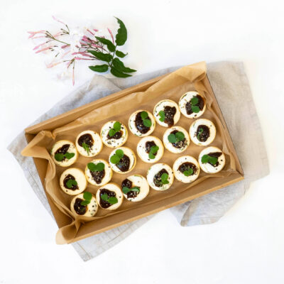 Goat's cheese, onion jam & rocket petite savoury tarts