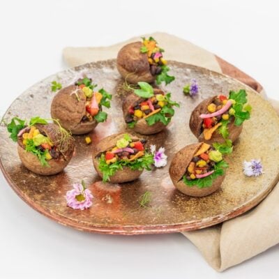 Mexican black bean slider, charred corn salsa, guacamole, tomato, lettuce and crunchy corn chips