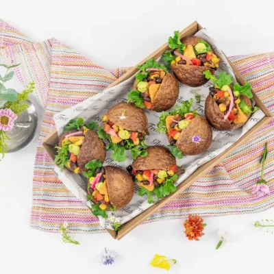 Mexican black bean slider, charred corn salsa, guacamole, tomato, lettuce and crunchy corn chips