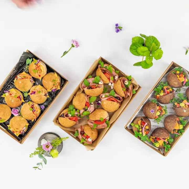 Mexican black bean slider, charred corn salsa, guacamole, tomato, lettuce and crunchy corn chips