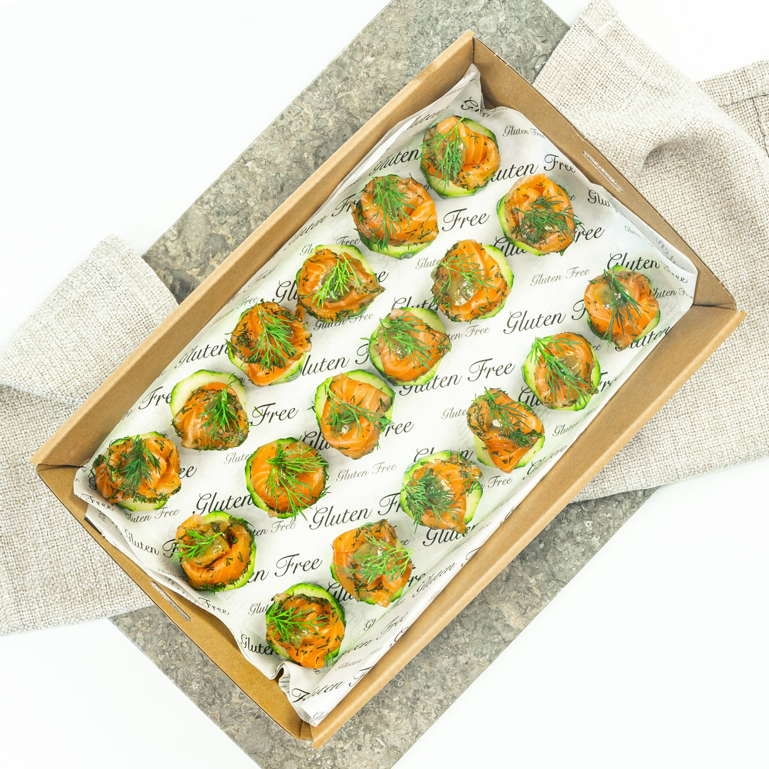 Gravlax - Dill cured salmon on cucumber disc, mustard dill dressing