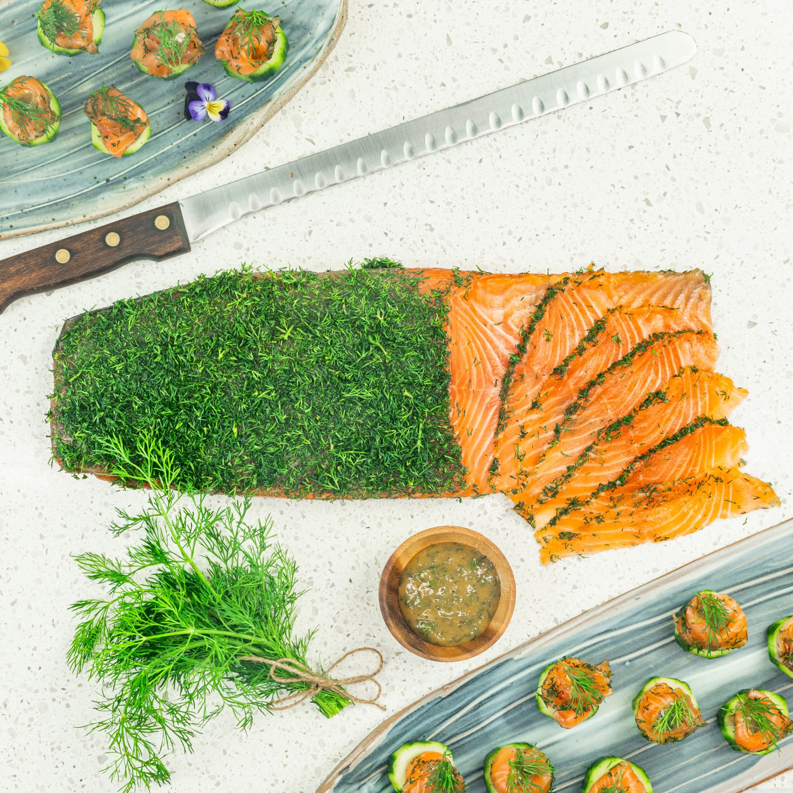 Gravlax - Dill cured salmon on cucumber disc, mustard dill dressing