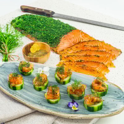 Gravlax - Dill cured salmon on cucumber disc, mustard dill dressing