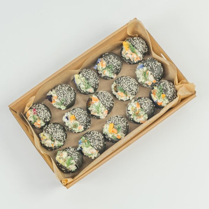 Australian prawn, citrus and dill remoulade, charcoal brioche baby bun, edible blooms