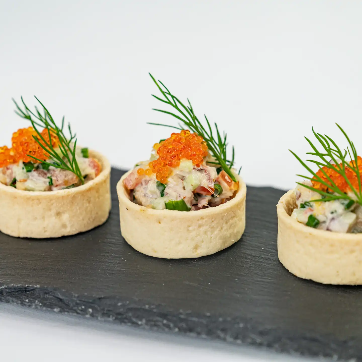 Blue swimmer crab tartlet, caviar pearls, native pickled onion and lemon myrtle mayo