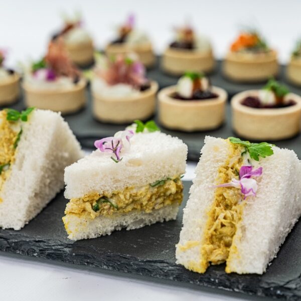 Coronation chicken mini sandwich, mango compote, baby herbs, mild curry mayonnaise