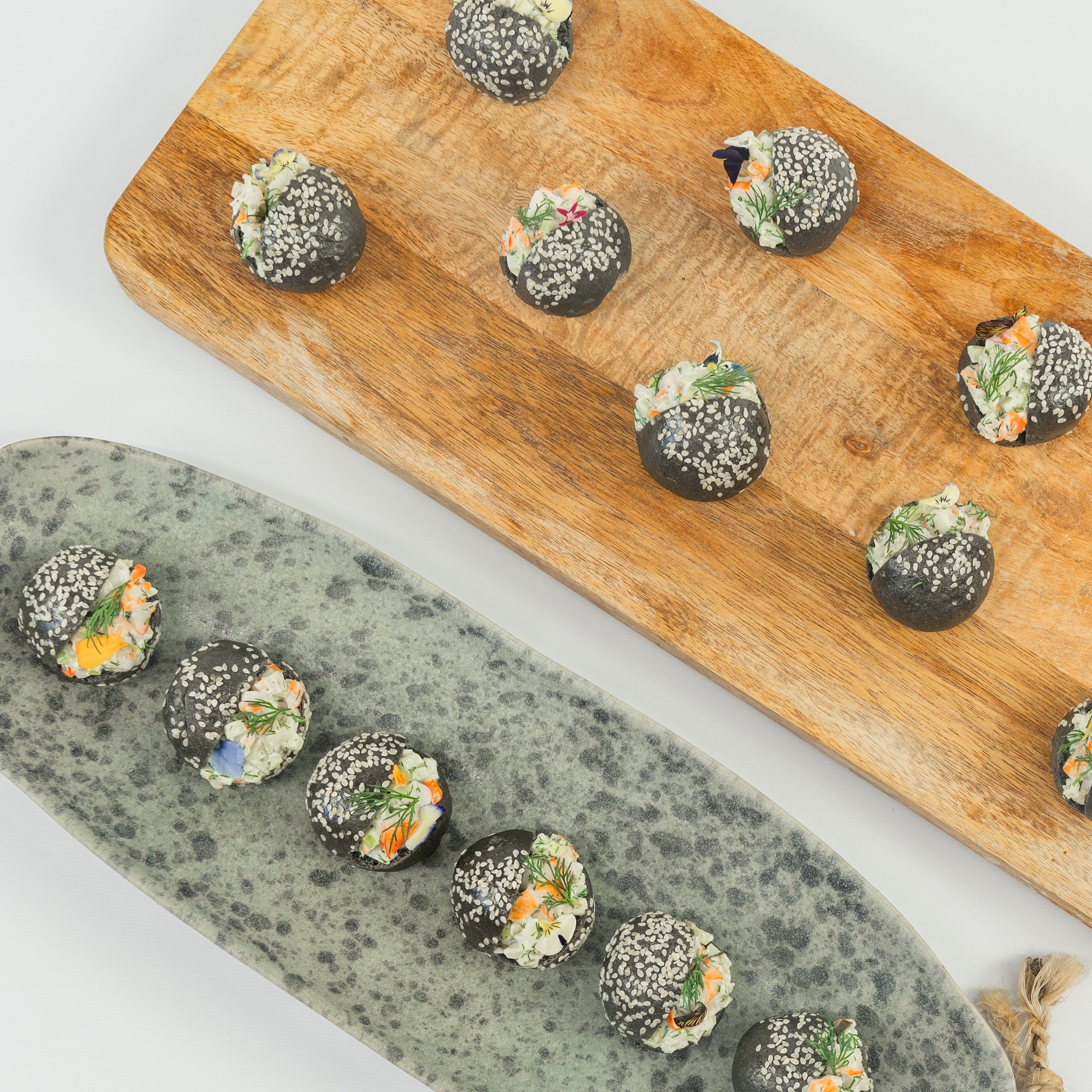 Australian prawn, citrus and dill remoulade, charcoal brioche baby bun, edible blooms