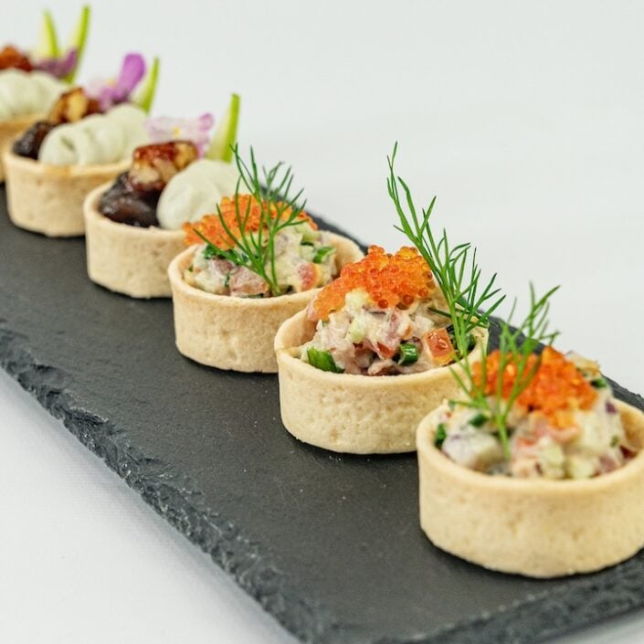Blue swimmer crab tartlet, caviar pearls, native pickled onion and lemon myrtle mayo