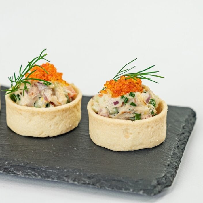 Blue swimmer crab tartlet, caviar pearls, native pickled onion and lemon myrtle mayo