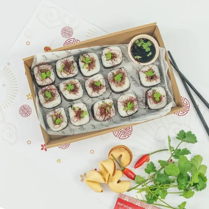 Beef teriyaki roll, white rice, seaweed, cucumber, baby coriander, chilli threads, soy dipping sauce