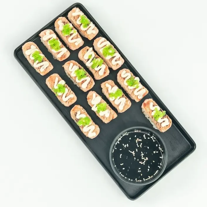 Flame grilled salmon nigiri, teriyaki glaze, wasabi fish roe