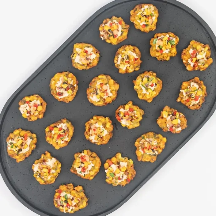 Mini corn fritter, chipotle pulled chicken, smoked paprika & pineapple corn salsa