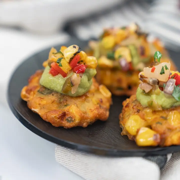 Charred sweetcorn fritter, avocado crema & pineapple corn salsa