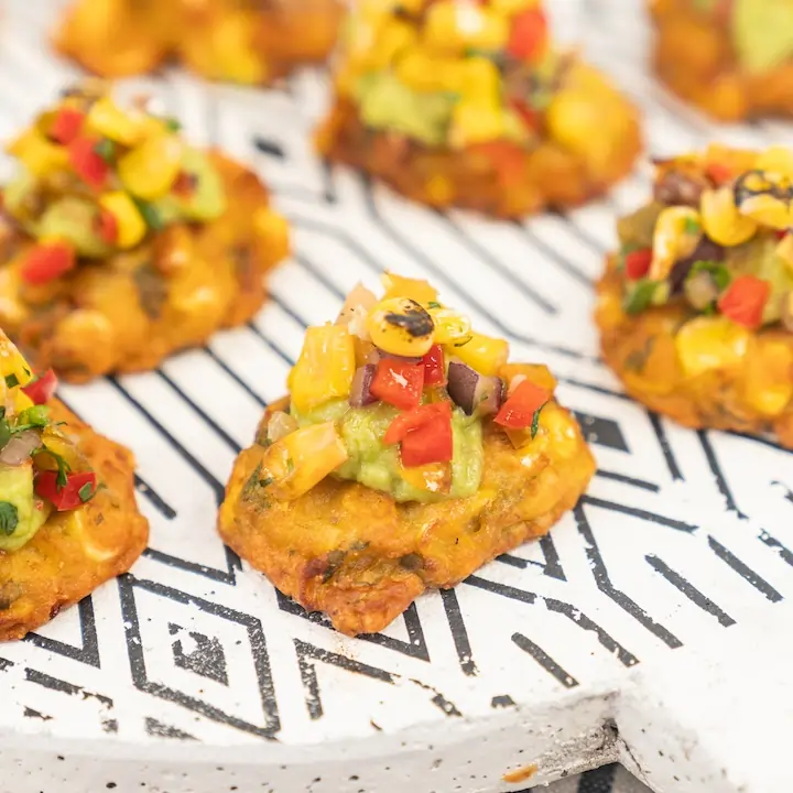 Charred sweetcorn fritter, avocado crema & pineapple corn salsa