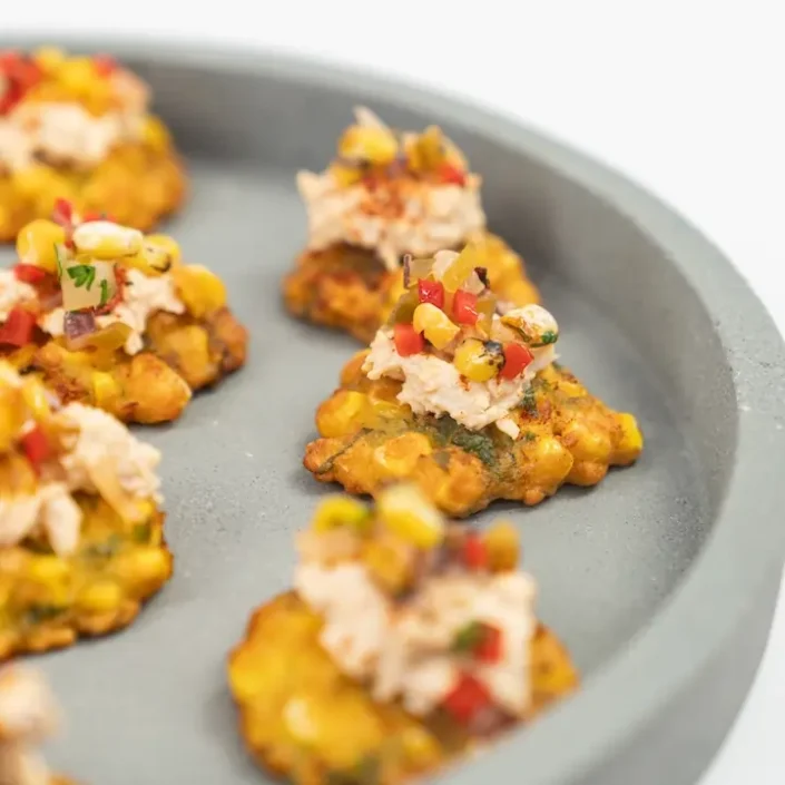 Mini corn fritter, chipotle pulled chicken, smoked paprika & pineapple corn salsa