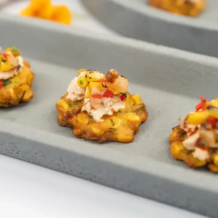 Mini corn fritter, chipotle pulled chicken, smoked paprika & pineapple corn salsa