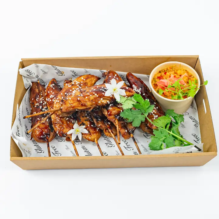 Teriyaki-glazed chicken skewer, toasted sesame, ginger-pineapple relish