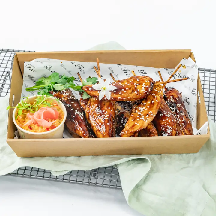 Teriyaki-glazed chicken skewer, toasted sesame, ginger-pineapple relish