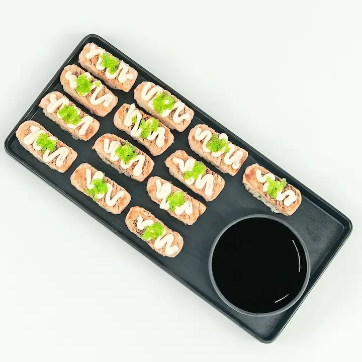 Flame grilled salmon nigiri, teriyaki glaze, wasabi fish roe