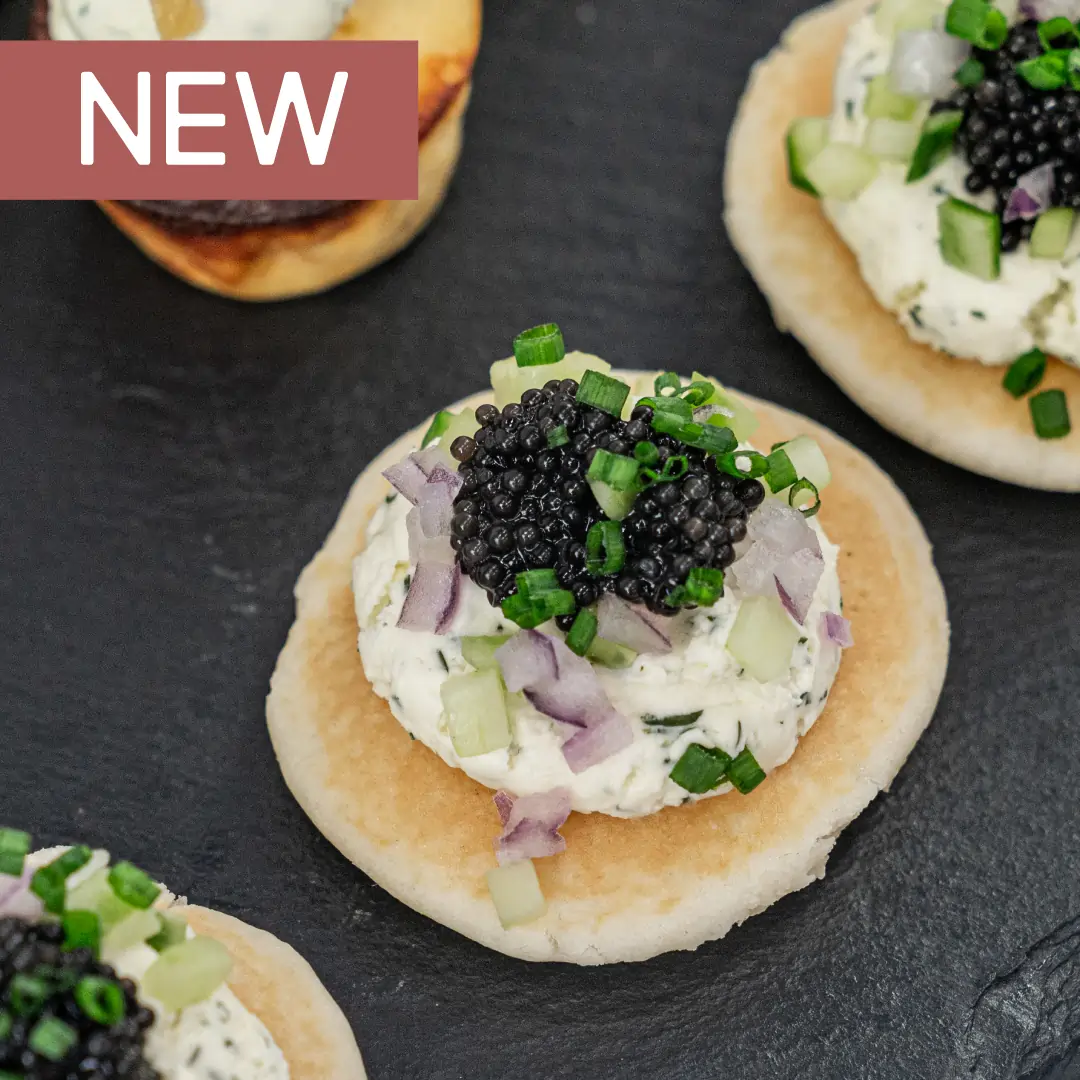 low-res-Drop-Off-catering---Blini,-crème-fraîche,-petite-black-caviar-pearls,-chive----cover-w-New-tag