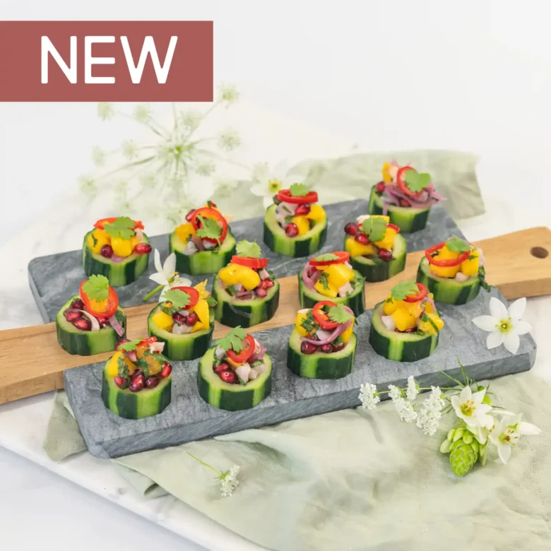 Mango, lychee & pomegranate salsa on cucumber disc with pickled chilli