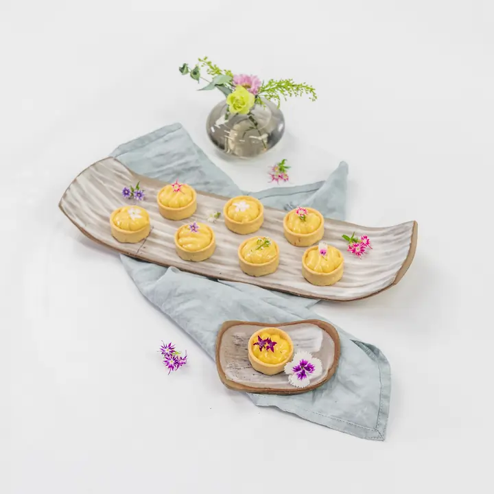 Petite lemon curd tartlet, edible bloom