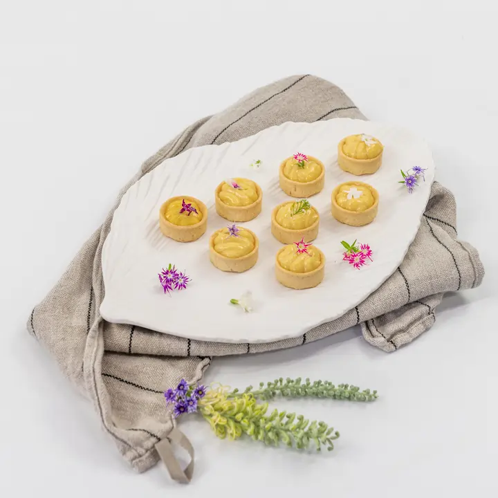 Petite lemon curd tartlet, edible bloom